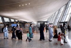 Afghan refugees arrive at Dulles International Airport on August 27, 2021 in Chantilly, Virginia after being evacuated from Kabul following the Taliban takeover of Afghanistan. (Photo by OLIVIER DOULIERY/AFP via Getty Images)