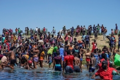 Haitian migrants cross the Rio Grande river on September 19, 2021. (Photo by PAUL RATJE/AFP via Getty Images)