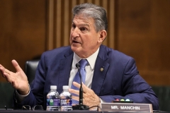 Sen. Joe Manchin (D-W.Va) is the pivotal vote on the Democrats' massive "human" infrastructure (entitlement) bill. He said he's in no rush to pass it. (Photo by OLIVER CONTRERAS/POOL/AFP via Getty Images)