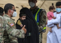 Both here and overseas, the U.S. military is housing tens of thousands of Afghan evacuees who are not yet vetted. (Photo by ARMANDO BABANI/AFP via Getty Images)