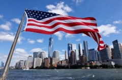 An American flag flies on a fireboat as it sails past lower Manhattan and One World Trade Center while taking part in a 9/11 commemorative flotilla in the Hudson River on September 10, 2021 in New York City. (Photo by Gary Hershorn/Getty Images)