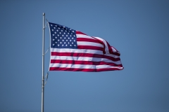 The American flag swirls in the wind. (Photo credit: Brett Carlsen/Getty Images)