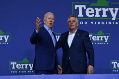 President Joe Biden (L) greets Virginia gubernatorial candidate Terry McAuliffe during a campaign event at Lubber Run Park, Arlington, Virginia on July 23, 2021. (Photo by BRENDAN SMIALOWSKI/AFP via Getty Images)