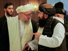 The Taliban’s ‘acting’ deputy prime minister Abdul Salam Hanafi, left, speaks to ‘acting’ Foreign Minister Amir Khan Muttaqi in Moscow on Wednesday. (Photo by Alexander Zemlianichenko / Pool / AFP via Getty Images)