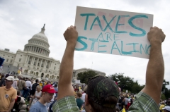 Demonstrators with the Tea Party protest the Internal Revenue Service (IRS) targeting of the Tea Party and similar groups during a rally called "Audit the IRS" outside the U.S. Capitol. (Photo credit: SAUL LOEB/AFP via Getty Images)