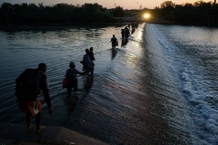 Migrants cross the Rio Grande near Del Rio, Texas in September. (Photo by Paul Ratje/AFP via Getty Images)