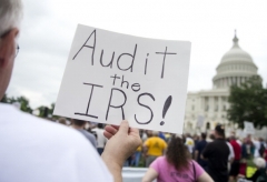 Conservatives protest the Internal Revenue Service's targeting of the Tea Party and similar groups during a rally in June 2013. (Photo by SAUL LOEB/AFP via Getty Images)