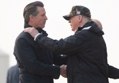 President Donald Trump greets then-California Governor-elect Gavin Newsom on a trip to California to view wildfire damage on November 17, 2018. (Photo credit should read SAUL LOEB/AFP via Getty Images)