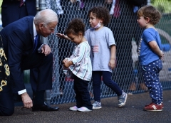 President Joe Biden greets children at the Capitol Child Development Center in Hartford, Connecticut, on October 15, 2021. (Photo by BRENDAN SMIALOWSKI/AFP via Getty Images)