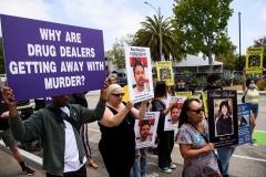 Family and friends of people who died after being poisoned by pills containing fentanyl protest on June 4, 2021 in Santa Monica, California. (Photo by PATRICK T. FALLON/AFP via Getty Images)