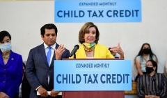 Speaker of the House Nancy Pelosi (D-Calif.) raises awareness of the Child Tax Credit in Los Angeles in July 15, 2021. (Photo by FREDERIC J. BROWN/AFP via Getty Images)