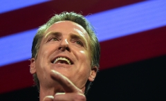 California Gov. Gavin Newsom speaks onstage at his election night watch party in Los Angeles, Calif. (Photo credit: FREDERIC J. BROWN/AFP via Getty Images)