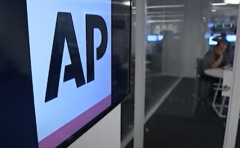 Featured is part of an Associated Press bureau. (Photo credit: YouTube/AP Archive)