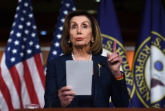 House Speaker Nancy Pelosi gives a speech. (Photo credit: OLIVIER DOULIERY/AFP via Getty Images)