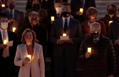 Speaker Nancy Pelosi and Senate Majority Leader Chuck Schumer participate in a moment of silence for 800,000 lives lost to COVID-19, Dec. 14, 2021. (Photo by Anna Moneymaker/Getty Images)