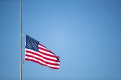 An American flag flies at half-staff. (Photo credit: Brett Carlsen/Getty Images)