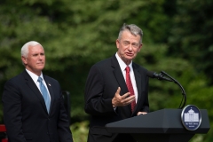 Former Vice President President Mike Pence listens as Idaho Gov. Brad Little (R-ID) speaks at the White House. (Photo credit: JIM WATSON/AFP via Getty Images)