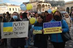 Ukrainians living in Greece hold banners during a protest against the Russian invasion of Ukraine, on February 24, 2022 in Athens, Greece. Overnight, Russia began a large-scale attack on Ukraine, with explosions reported in multiple cities and far outside the restive eastern regions held by Russian-backed rebels. (Photo by Milos Bicanski/Getty Images)