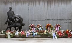 Wreaths are laid in front of a sculpture by German Waldemar Grzimek at the "Station Z" memorial site at the former Sachsenhausen concentration camp to commemorate the anniversary of the camp's liberation in April 1945, in Oranienburg, north of Berlin, on April 18, 2021. The camp was liberated by Soviet troops on April 22, 1945. (Photo credit: SOEREN STACHE-POOL-AFP via Getty Images)