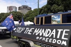 A convoy of trucks and other vehicles parked on the streets in front of parliament in Wellington, New Zealand. (Photo by Marty Melville/AFP via Getty Images)