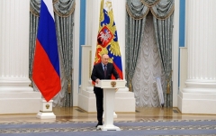 Russian President Vladimir Putin speaks to the press at the Kremlin on Tuesday. (Photo by Mikhail Klimentyev/ Sputnik /AFP via Getty Images)