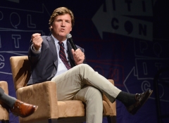 Tucker Carlson gives a speech at Politicon. (Photo credit: Chelsea Guglielmino/Getty Images)