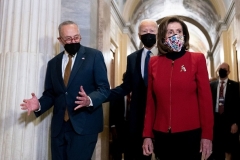 Democrats Joe Biden, President; Chuck Schumer, Senate Majority Leader; and Nancy Pelosi, House Speaker, at the U.S. Capitol. (Photo by STEFANI REYNOLDS/AFP via Getty Images)