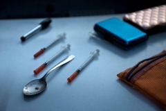 Paraphernalia for smoking and injecting drugs is confiscated during a police search in Huntington, West Virginia. (Photo by BRENDAN SMIALOWSKI/AFP via Getty Images)