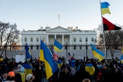 Protesters wave Ukrainian flags in front of the White House to protest the increased tension between Russia and Ukraine on February 20, 2022. (Photo by STEFANI REYNOLDS/AFP via Getty Images)