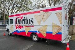 Featured is the logo for Doritos brand chips, a product of snack food manufacturer Frito Lay, on a delivery truck. (Photo credit: Smith Collection/Gado/Getty Images)