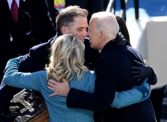 President Joe Biden hugs his son Hunter Biden his wife after being sworn in as the 46th President, on January 20, 2021. (Photo by OLIVIER DOULIERY/AFP via Getty Images)