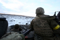 Ukrainian troops sit in their armoured vehicle after fighting Russian troops and Russia-backed separatists near Zolote village, Lugansk region on March 6, 2022. (Photo by ANATOLII STEPANOV/AFP via Getty Images)