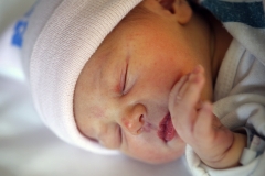 Pictured is a newborn baby. (Photo credit: Tim Clayton/Corbis via Getty Images)