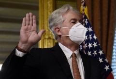 Vice President Kamala Harris (out of frame) ceremonially swears in William Burns as director of the Central Intelligence Agency on March 23, 2021. (Photo credit: OLIVIER DOULIERY/AFP via Getty Images)