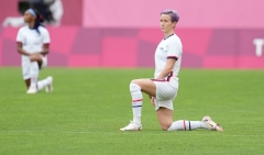 Women's soccer player Megan Rapinoe takes a knee on the field. (Photo credit: Brad Smith/ISI Photos/Getty Images)