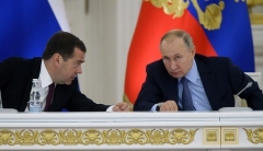 Then-Prime Minister Dmitry Medvedev consults with President Vladimir Putin at the Kremlin in December 2019. (Photo by Mikhail Svetlov/Getty Images)