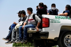 Illegal immigrants are detained by U.S. Customs and Border Protection at the border near San Luis, Arizona. (Photo by Nick Ut/Getty Images)