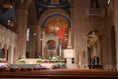 Reverend Wilton D. Gregory, Archbishop of Washington, celebrates an Easter Sunday mass in front of empty pews at the Basilica of the National Shrine of the Immaculate Conception in Washington, D.C. on April 12, 2020 as the Basilica remained closed to the public during the COVID-19 coronavirus pandemic. (Photo credit: EVA HAMBACH/AFP via Getty Images)