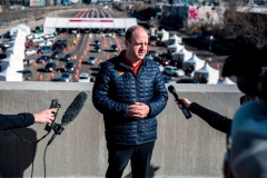 Colorado Governor Jared Polis speaks to the press as he visits the site of a mass vaccination drive through at Coors Field baseball stadium on January 30, 2021, in Denver, Colorado. (Photo by CHET STRANGE/AFP via Getty Images)