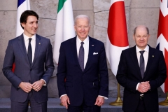 Canada's Prime Minister Justin Trudeau, U.S. President Joe Biden and Germany's Chancellor Olaf Scholz pose during a G7 leaders' family photograph at a NATO summit at the alliance's headquarters in Brussels on March 24, 2022. (Photo by HENRY NICHOLLS/POOL/AFP via Getty Images)
