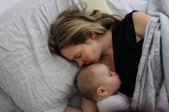 A mother cuddles with a baby. (Photo credit: Tim Clayton/Corbis via Getty Images)