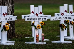Crosses adorn a makeshift memorial for the shooting victims at Robb Elementary School in Uvalde, Tex., on May 26, 2022. (Photo credit: