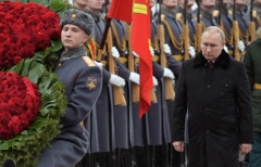 Russian President Vladimir Putin attends a wreath laying ceremony at the Tomb of the Unknown Soldier by the Kremlin wall to mark the Defender of the Fatherland Day in Moscow on Feb. 23. (Photo credit: ALEXEY NIKOLSKY/SPUTNIK/AFP via Getty Images)