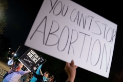Pro-life and pro-choice activists clashed outside the US Supreme Court on May 2, 2022 following the reported leak of a draft opinion indicating that Roe v. Wade might be overturned. (Photo by STEFANI REYNOLDS/AFP via Getty Images)