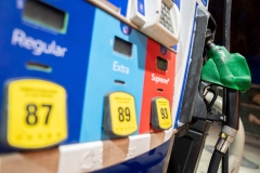 A gasoline pump sits in a holder at an Exxon gas station in Washington, D.C. (Photo credit: STEFANI REYNOLDS/AFP via Getty Images)