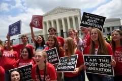Pro-life protesters celebrate outside the Supreme Court after the overturn of Roe v. Wade. (Photo credit: OLIVIER DOULIERY/AFP via Getty Images)