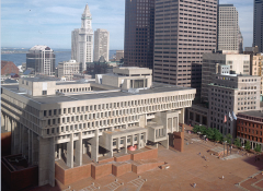 Boston City Hall and its adjoining Government Center plaza shows three flagpoles in the lower right corner. (Photo by Visions of America LLC/Corbis via Getty Images)