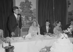 John F. Kennedy toasts his brother, Ted Kennedy, and Ted Kennedy's bride, Joan Bennett, at their wedding reception, 1958. (Photo by Bachrach/Getty Images)