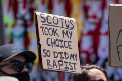 Protesters hold signs to denounce the U.S. Supreme Court at Venice Beach on July 4, 2022 in Los Angeles, California. The Supreme Court's June 24th decision in the Dobbs v Jackson Women's Health case overturned the landmark 50-year-old Roe v Wade case, removing a federal right to an abortion. (Photo by David McNew/Getty Images)