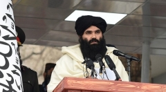 Sirajuddin Haqqani, an FBI wanted terrorist, is the Taliban regime’s interior minister. Here he addresses police recruits in Kabul last March. (Photo by Wakil Kohsar/AFP via Getty Images)